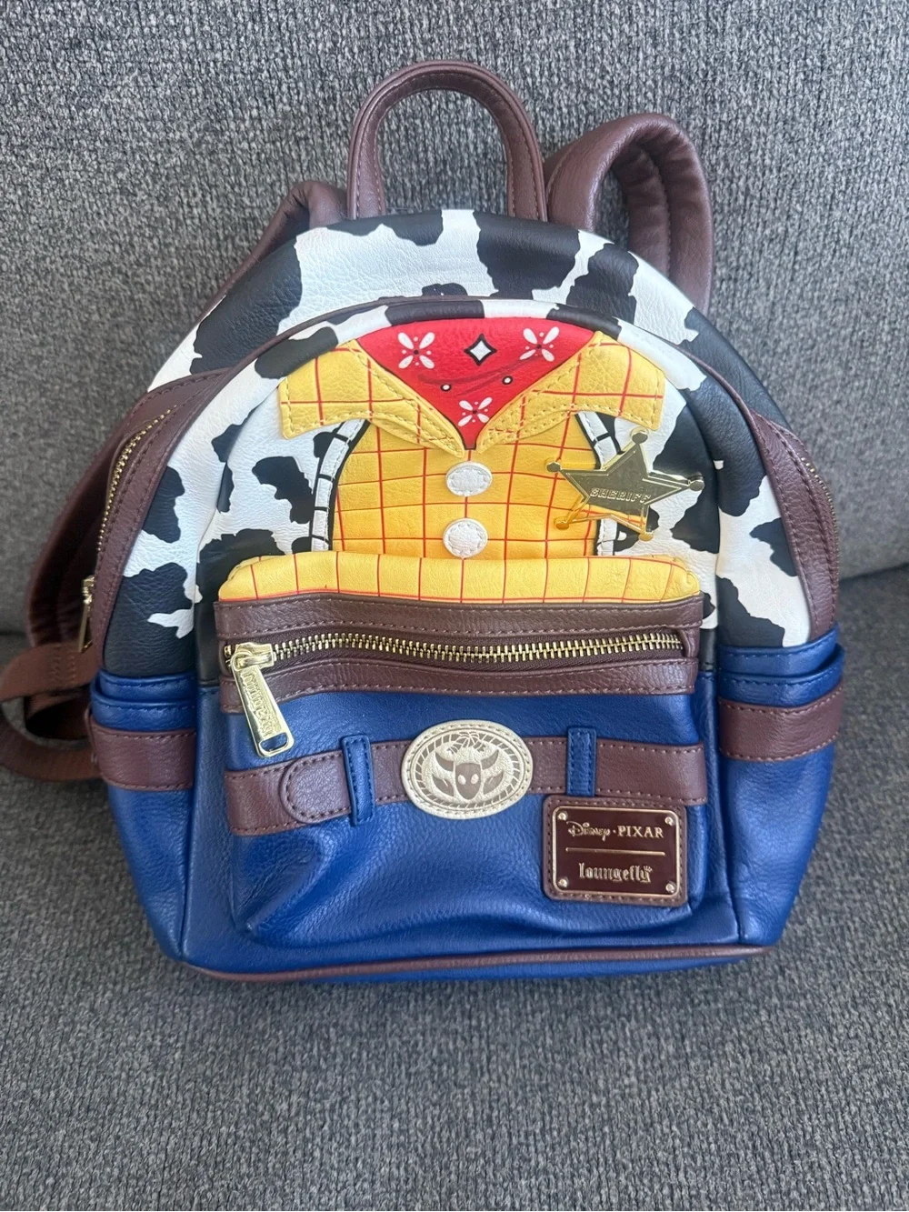 Loungefly Disney Pixar Woody Mini Backpack – Blue, Brown, Yellow
